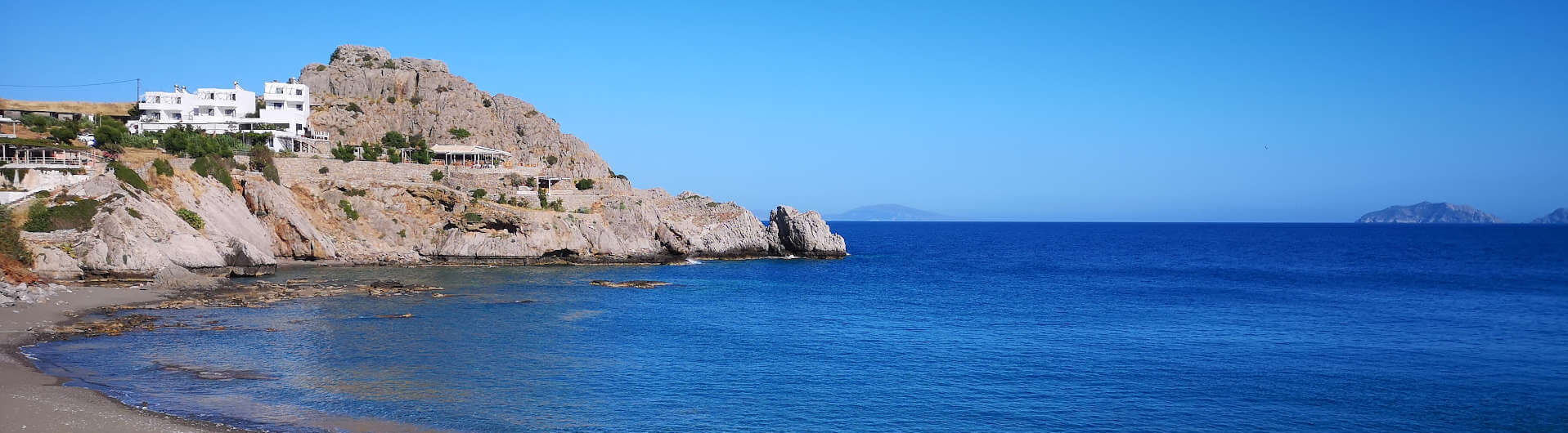 Agios Pavlos sandy beach with umbrellas just below Yoga Rocks The sandy beach at Agios Pavlos just down from Yoga Rocks retreat