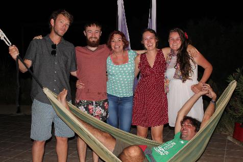 Hammock and happy campers on yoga holiday in Greece