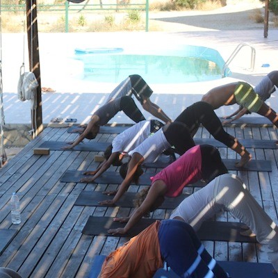 adhomukhasvanasana on yoga deck