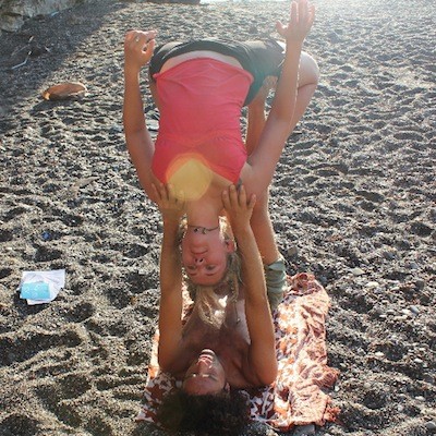 flying back bend on the beach at yoga rocks