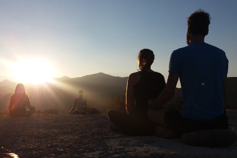 Sunrise meditation on yoga retreat
