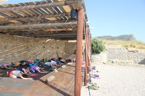 Childs pose or balasana on the outside yoga deck