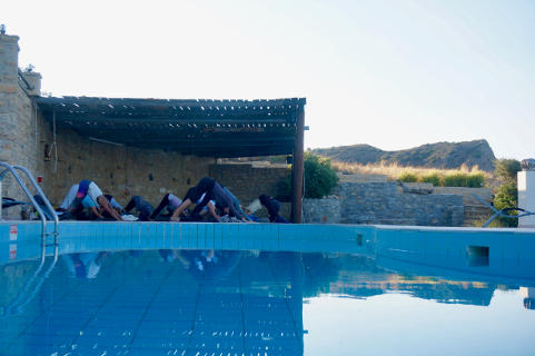 Adho mukha svanasana with Sky at Yoga Rocks, Crete