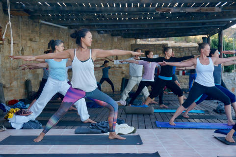 Utthita parsva konasana on Yoga Rocks outside deck