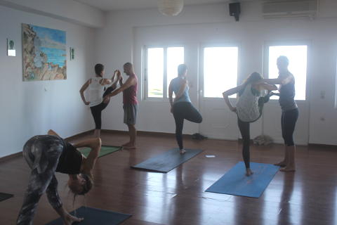 Melanie Cooper assisted by Emil Lime on retreat at Yoga Rocks
