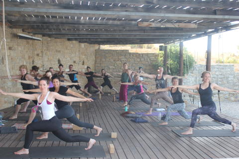 Smiling yoga on on the deck on retreat
