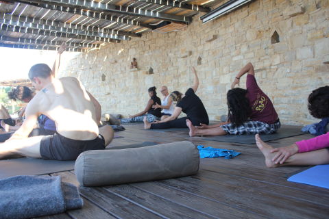 Gösta(Shunya) assists yogis in parivrtta janu sirsasana o the deck in Crete