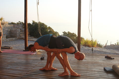 Partner yoga by the sea in Crete
