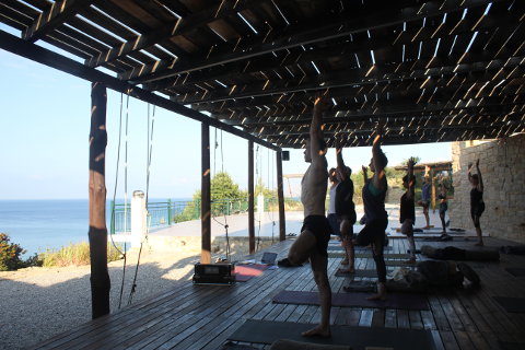 Tree pose with Gösta(Shunya) on the deck at Yoga Rocks