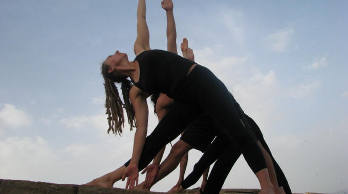 Triangle pose on yoga holiday in Crete