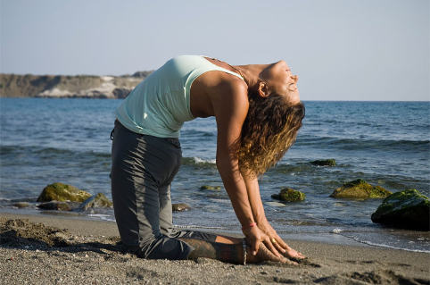 Camel pose on the beach in Crete, Grece