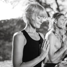 Sandra Howling. coming to Yoga Rocks retreat Crete, in namaskar with John Scott