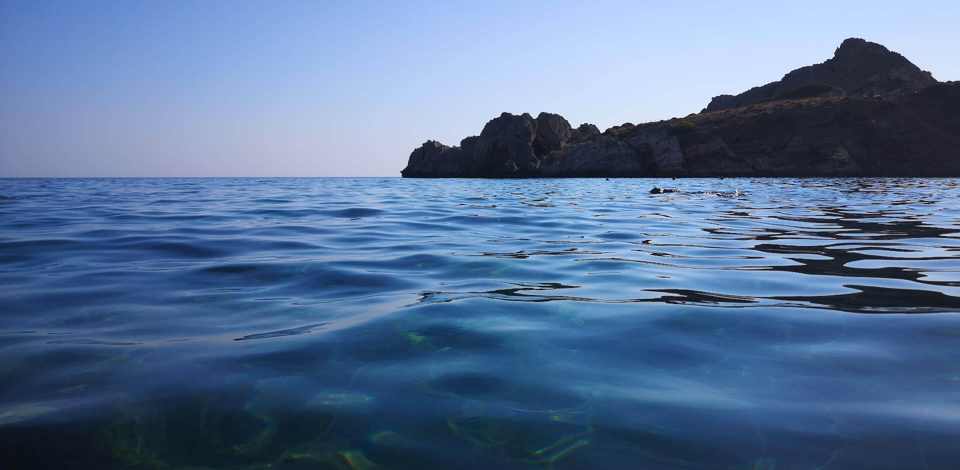 The clear waters of Agios Pavlos bay with the sleepy dragon just below Yoga Rocks retreat Crete