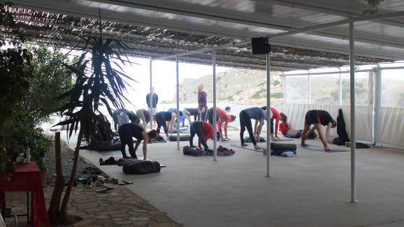 Led primary series on the terrace at Yoga Rocks retreat Crete with Melanie Cooper and Emil Lime