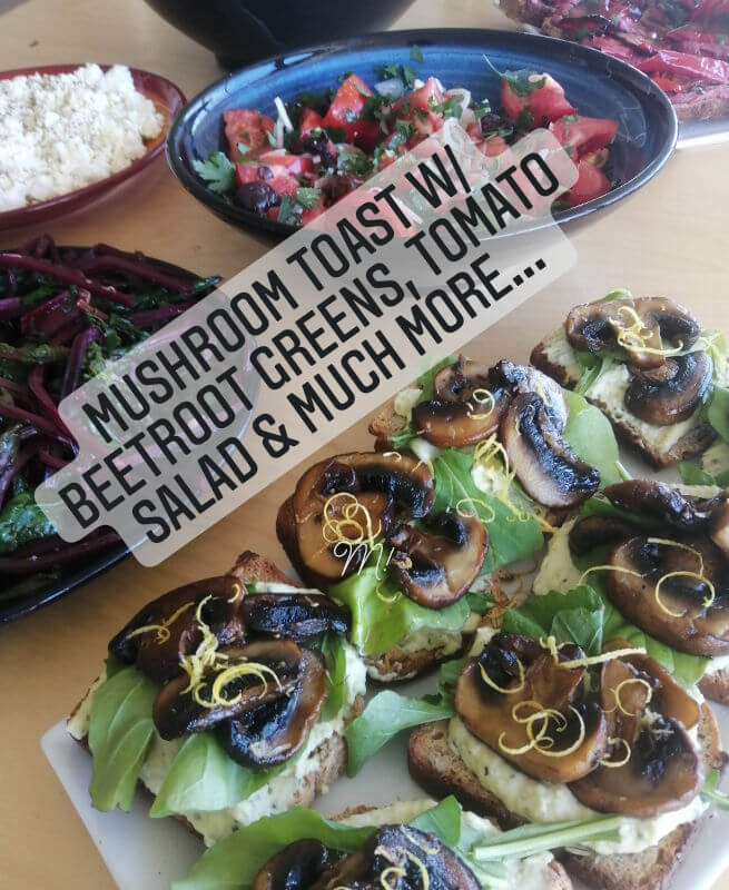 A deluxe lunch toast with amazing sides of beetroot greens and tomato salad and mizethra