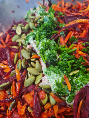 Grated carrot and beetroot with pumpkin seeds, parsley and tahini sauce